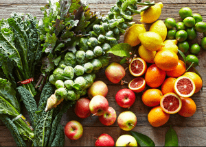 a group of fruits and vegetables on a wood surface Healthy Weight Loss Diets Warwickshire