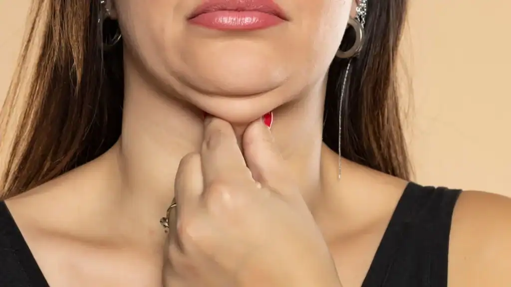 An image of a woman with double chin, sad, worried : Non Surgical Double Chin Removal Treatment in Warwickshire, UK